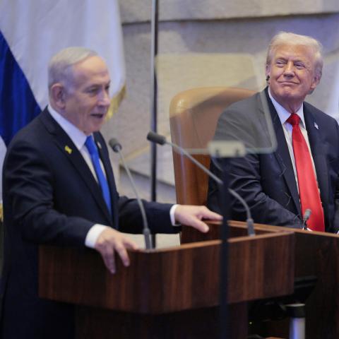 Israeli Prime Minister Benjamin Netanyahu addresses the Knesset as President Donald Trump and Amir Ohana, speaker of the Israeli Knesset, look on October 13, 2025, in Jerusalem. (Getty Images)