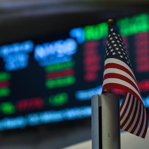 An American flag is displayed on a desk on the floor of the New York Stock Exchange (NYSE) at the opening bell on July 15, 2025, in New York City. (Getty Images)