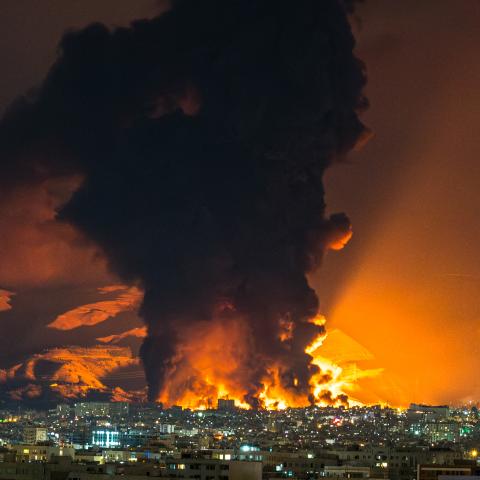 Smoke and flames rise at the site of airstrikes on an oil depot in Tehran on March 7, 2026. (Getty Images)