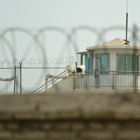This picture taken on July 19, 2023 shows a view of a watchtower of an alleged detention facility in Artux in Kizilsu Prefecture in China's northwestern Xinjiang region. Since 2017, more than a million Uyghurs and other Muslims have been swept into internment camps where human rights abuses are commonplace, researchers, campaigners and members of the diaspora say. Beijing says the facilities were voluntary centres for teaching vocational skills, closed years ago after their inhabitants "graduated" into stab