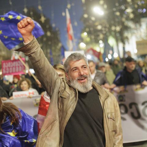 Tbilisi residents protest after the Georgian Dream government announced a suspension of negotiations on EU candidate status until 2028, as police detain demonstrators during a crackdown in the capital on November 28, 2025. (Photo by Sebastien Canaud/NurPhoto via Getty Images)
