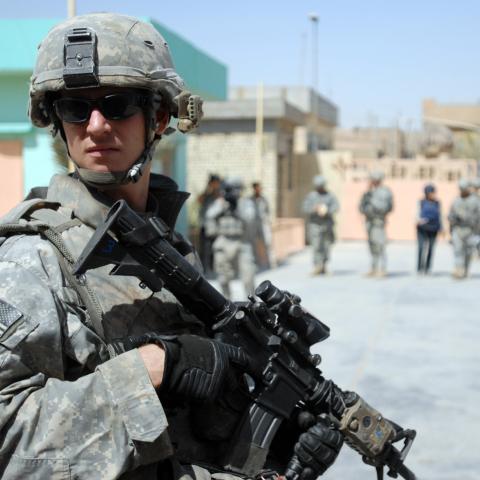 A US soldier pulls security at the al-Faw intermediate school in the Sadr City area of Baghdad on August 15, 2008. (US Army)