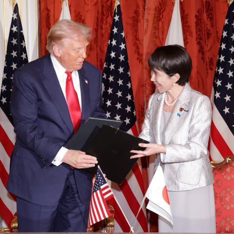 President Donald Trump and Japanese Prime Minister Sanae Takaichi exchange documents at the Akasaka Palace on October 28, 2025, in Tokyo, Japan. (Getty Images)