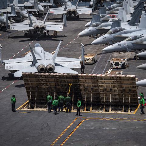 250709-N-IP140-1048 U.S. CENTRAL COMMAND AREA OF RESPONSIBILITY (July 9, 2025) U.S. Sailors conduct routine maintenance on a jet blast deflector on the flight deck of the Nimitz-class aircraft carrier USS Nimitz (CVN 68) in the U.S. Central Command area of responsibility. (Official U.S. Navy photo)
