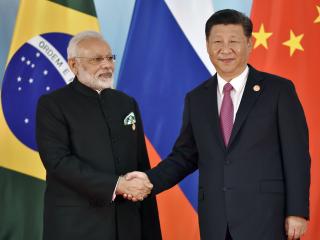 President Xi Jinping (R) and Indian Prime Minister Narendra Modi shake hands before the group photo during the BRICS Summit at the Xiamen International Conference and Exhibition Center in Xiamen, southeastern China's Fujian Province on September 4, 2017. 