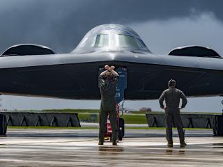 A pilot marshals a B-2 Spirit bomber at Andersen Air Force Base in Guam on June 13, 2024. (US Air Force photo)
