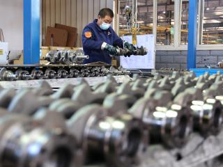 A quality inspector checks crankshafts at a factory that produces the mechanical component for the domestic market and export in Binzhou, China, on December 10, 2024. (Getty Images)