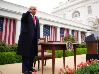 US President Donald Trump reacts after signing executive orders imposing tariffs on imported goods in the Rose Garden at the White House on April 2, 2025, in Washington, DC. (Andrew Harnik via Getty Images)