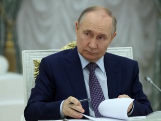 Russian President Vladimir Putin listens during a meeting on the development of occupied regions of Ukraine at the Kremlin on June 30, 2025. (Getty Images)