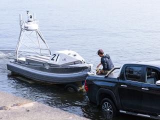 A service member working with Command Task Force 66 unloads a Global Autonomous Reconnaissance Craft into the Port of Uskta during exercise Baltic Operations 2025 (BALTOPS 25) on June 8, 2025. (US Navy photo)