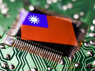 A microchip and Taiwanese flag displayed on a phone screen are seen in this multiple exposure illustration photo on April 10, 2023. (Jakub Porzycki via Getty Images)