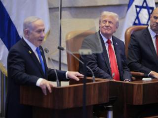 Israeli Prime Minister Benjamin Netanyahu addresses the Knesset as President Donald Trump and Amir Ohana, speaker of the Israeli Knesset, look on October 13, 2025, in Jerusalem. (Getty Images)
