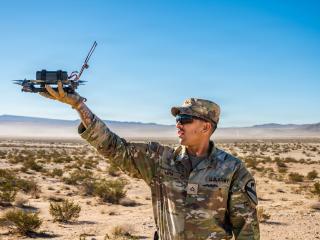 A US infantryman releases a Neros Archer small unmanned aircraft system for a test flight at the Fort Irwin in California on October 25, 2025. (US Army)