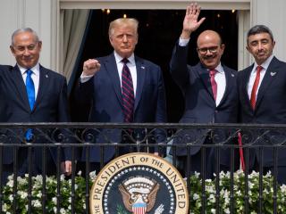 Israeli Prime Minister Benjamin Netanyahu, President Donald Trump, Bahrain Foreign Minister Abdullatif al-Zayani, and UAE Foreign Minister Abdullah bin Zayed Al-Nahyan wave from the Truman Balcony after signing the Abraham Accords in Washington, DC, on September 15, 2020. (Getty Images)