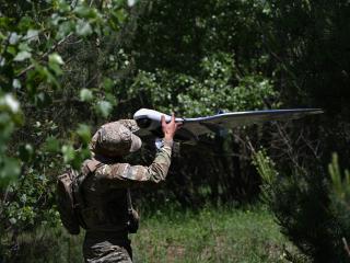 serviceman of the State Border Guard Service of Ukraine prepares an UAV for a patrol flight along the Ukraine-Belarus border in Chernigiv region on June 1, 2026. (Getty Images)
