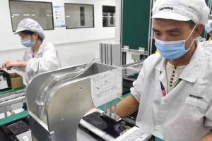 Employees assemble phone components at a Lenovo/Motorola factory in Wuhan, China, on Aug. 20, 2021. (Getty Images)