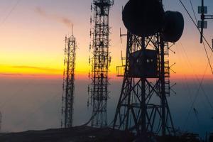 Signal receiving tower equipment at sunset. (Getty Images)