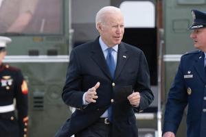 U.S. President Joe Biden is greeted by Colonel Matthew Jones, Commander, 89th Airlift Wing, at Joint Base Andrews in Maryland, on March 23, 2022. (Getty Images)