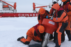 Members of China's research team set up an ocean profiling float at a short-term data acquisition location near the icebreaker Xuelong, or "Snow Dragon," in the Arctic Ocean, on August 18, 2016. (Xinhua/Wu Yue via Getty Images) 