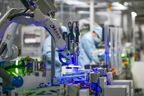 JINHUA, CHINA - FEBRUARY 22: A robotic arm is seen on the assembly line of computer at a computer manufacturing enterprise set up by Tsinghua Tongfang Co., Ltd on February 22, 2022 in Jinhua, Zhejiang Province of China. (Photo by Hu Xiaofei/VCG via Getty Images)