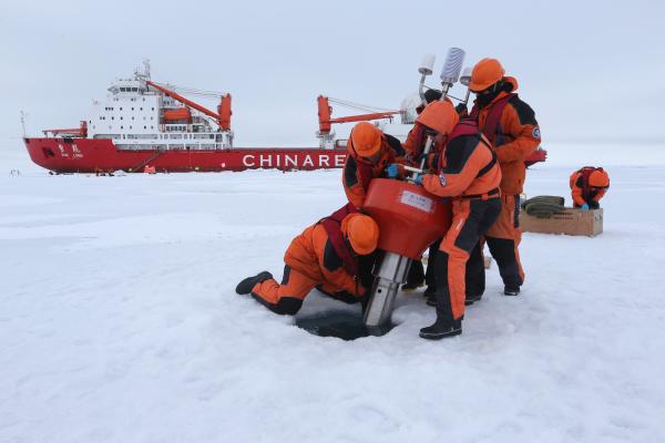 Members of China's research team set up an ocean profiling float at a short-term data acquisition location near the icebreaker Xuelong, or "Snow Dragon," in the Arctic Ocean, on August 18, 2016. (Xinhua/Wu Yue via Getty Images)