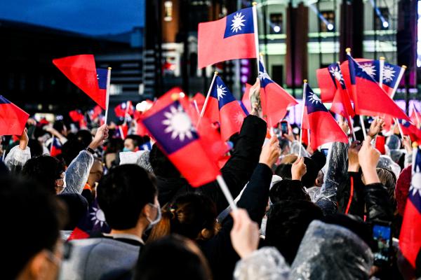 People wave Taiwanese flags in front of the Presidential Office Building of Taiwan on January 1, 2023, in Taipei, Taiwan. (Gene Wang/Getty Images)