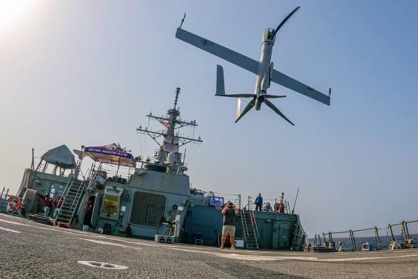 An Aerovel Flexrotor unmanned aerial vehicle lands on the flight deck of guided-missile destroyer USS Paul Hamilton in the Gulf of Oman on June 26, 2023. (Elliot Schaudt via DVIDS)