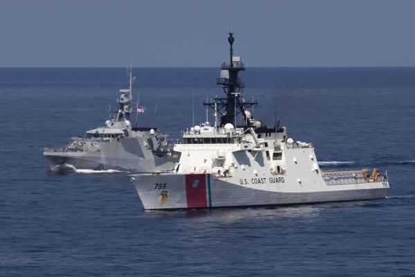 U.S. Coast Guard Cutter Munro (WMSL 755) (foreground) conducts coordinated ship maneuvers with Royal Navy vessel HMS Spey (P234) Sept. 17, 2023, in the South China Sea. Munro is deployed to the Indo-Pacific to advance relationships with ally and partner nations to build a more stable, free, open and resilient region with unrestricted, lawful access to the maritime commons. (U.S. Navy photo by Chief Petty Officer Brett Cote)