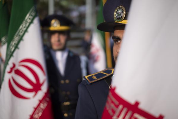 Members of an Iranian Army honor guard stand next to Iran's flags during a military parade marking Iran's Army Day anniversary near the Imam Khomeini shrine in the south of Tehran on April 18, 2023. (Morteza Nikoubazl/NurPhoto via Getty Images)