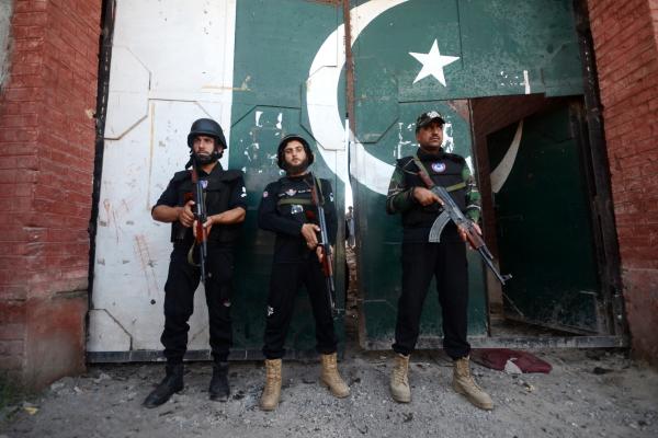 Security forces take a measure in front of a damaged police compound after a suicide bombing attack in Bara, Khyber Pakhtunkhwa, Pakistan, on July 20, 2023. (Hussain Ali/Anadolu Agency via Getty Images)