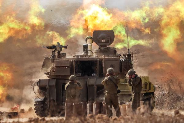 An Israeli army M109 155mm self-propelled howitzer fires rounds near the border with Gaza in southern Israel on October 11, 2023. (Photo by Jack Guez/AFP via Getty Images)