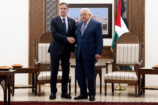 Palestinian Authority President Mahmud Abbas and US Secretary of State Antony Blinken shake hands prior to a meeting at the Muqata, the presidential compound in the West Bank city of Ramallah, on November 30, 2023. (Photo by Saul Loeb/Pool/AFP via Getty Images)