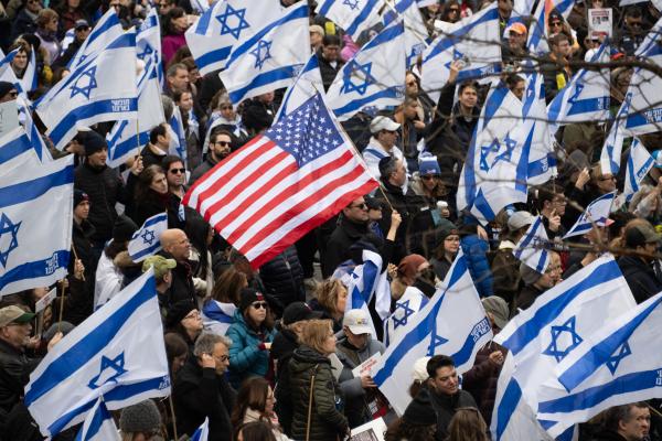 Demonstrators hold US and Israeli flags during a rally in Central Park marking 150 days since hostages were taken in attack on Israel on March 10, 2024 in New York City. (Photo by Noam Galai/Getty Images)