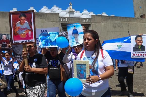 Members of the organization Mothers of April hold portraits of their late loved ones outside the Cathedral in Managua on February 23, 2020. (Inti Ocon/AFP via Getty Images)