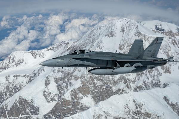 North American Aerospace Defense Command CF-18 Hornet flies in formation with a KC-135 Stratotanker after escorting a B-52 Stratofortress across Northern Alaska, June 18, 2024. (DVIDS)