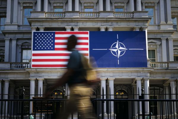 The US and NATO flags hang on a building in Washington, DC, on July 9, 2024. (Thomas Trutschel/Photothek via Getty Images)