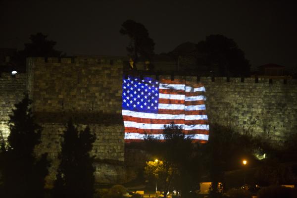 The flag of the United States is projected on the wall of Jerusalem's Old City on December 6, 2017, in Jerusalem, Israel. (Lior Mizrahi via Getty Images)