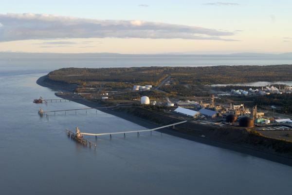 A landscape marked by the oil and gas industry, September 27, 2008, at Nikiski Beach and Cook Inlet in Kenai, Alaska. The region is considered the 'ground zero' for oil and gas in Alaska, one of the top two oil producing states in the country. Lower right is Agrium Nitrogen Operations and left of that is Conoco Phillips LNG (liquefied natural gas) Facility. (Photo by Farah Nosh/Getty Images)
