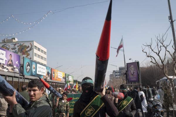 Members of the Basij paramilitary force under the command of the Islamic Revolutionary Guard Corps (IRGC) carry scale model missiles in a military rally in downtown Tehran, Iran, on January 10, 2025. (Photo by Morteza Nikoubazl/NurPhoto via Getty Images)