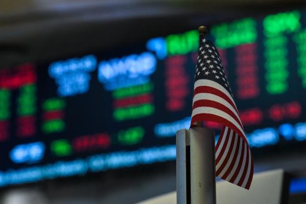 An American flag is displayed on a desk on the floor of the New York Stock Exchange (NYSE) at the opening bell on July 15, 2025, in New York City. (Getty Images)