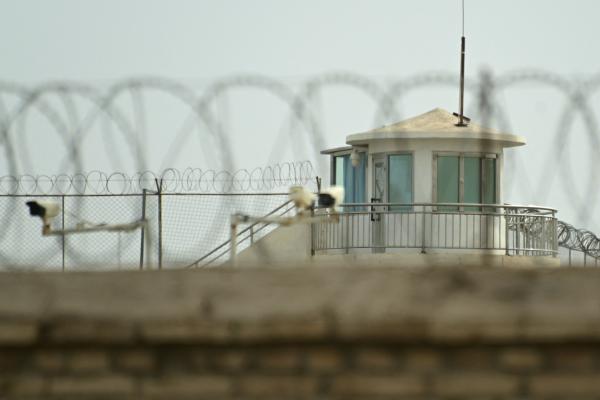 This picture taken on July 19, 2023 shows a view of a watchtower of an alleged detention facility in Artux in Kizilsu Prefecture in China's northwestern Xinjiang region. Since 2017, more than a million Uyghurs and other Muslims have been swept into internment camps where human rights abuses are commonplace, researchers, campaigners and members of the diaspora say. Beijing says the facilities were voluntary centres for teaching vocational skills, closed years ago after their inhabitants "graduated" into stab