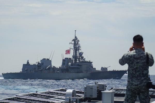 A member of the Philippine Navy looks out at as the Japan Maritime Self-Defense Force destroyer JS Takanami during a joint maritime exercise in the South China Sea on June 14, 2025. (Getty Images)