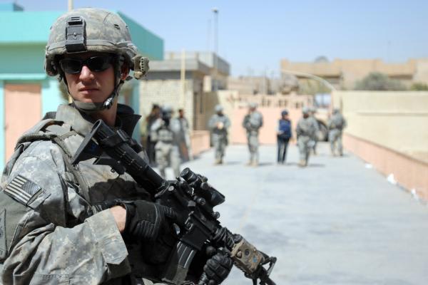 A US soldier pulls security at the al-Faw intermediate school in the Sadr City area of Baghdad on August 15, 2008. (US Army)