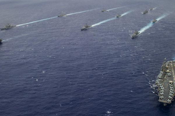 Ships from the George Washington and Carl Vinson Carrier Strike Groups steam in formation at the conclusion of Valiant Shield 2014. (U.S. Navy/Mass Communication Specialist 3rd Class Paolo Bayas/Released)
