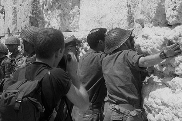 At the end of the Six Day War, Israeli soldiers hug and kiss the stones of the Western Wall, Old City of Jerusalem, Israel, June 11, 1967 (Dan Porges/Getty Images)