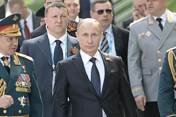 Russian President Vladimir Putin at the Tomb of the Unknown Soldier in Moscow on May 9, 2015 (RIA Novosti via Getty Images)