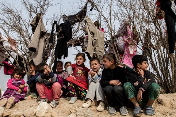 Yezidi children seen at a small IDP camp near Snyuy, an Iraqi city at the base of Mount Sinjar. (Sebastian Backhaus/NurPhoto via Getty Images)