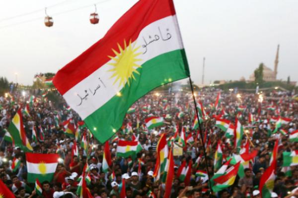 Iraqi Kurds fly Kurdish flags during an event to urge people to vote in the upcoming independence referendum, September 16, 2017 (SAFIN HAMED/AFP/Getty Images)