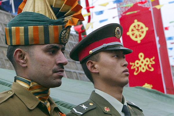 An Indian soldier and his Chinese counterpart at a ceremony marking the re-opening of the China-India border, July 6, 2006 (DESHAKALYAN CHOWDHURY/AFP/Getty Images)