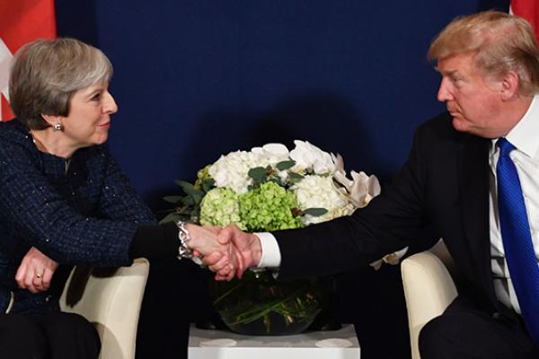 US President Donald Trump and Britain's Prime Minister Theresa May shake hands during a bilateral meeting on the sidelines of the World Economic Forum annual meeting in Davos, eastern Switzerland, January 25, 2018.